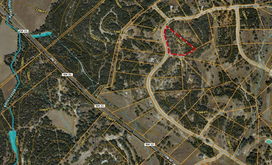 The lot is outlined in red, and shows it's proximity to FM 32, as well as the topographical lines.  