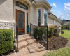 Fenced entry to the home. HOA cares for lawn and landscaping