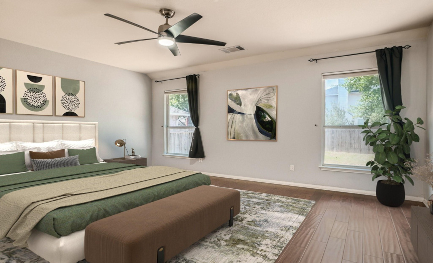 Virtually Staged: The owner's suite is complete with a modern ceiling fan and an ensuite bathroom.