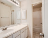 The shared full bath is complete with a large vanity and a separate shower room so two people can get ready at once!