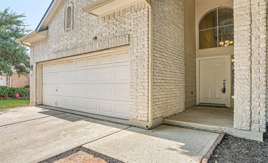 A beautiful brick façade greets you at the entry, with thoughtfully placed stepping stones leading to the backyard.