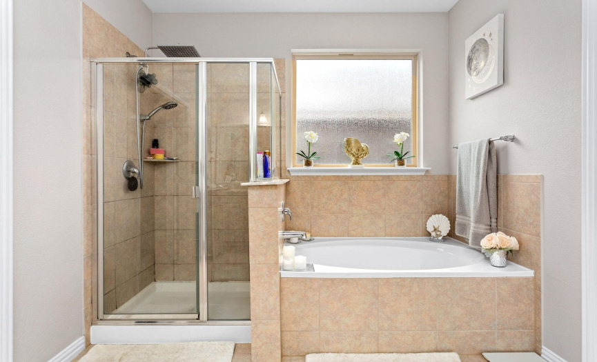 Convenience and functionality are essential to this stress fee oasis.   Whether it is unwinding in a steam shower or soaking in a warm garden tub, this spa like bathroom is sure to satisfy you and your partner.