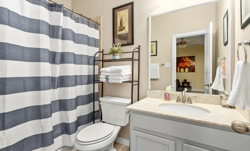 This full bathroom on the second level sits just off the game room area, allowing convenience for your guests.