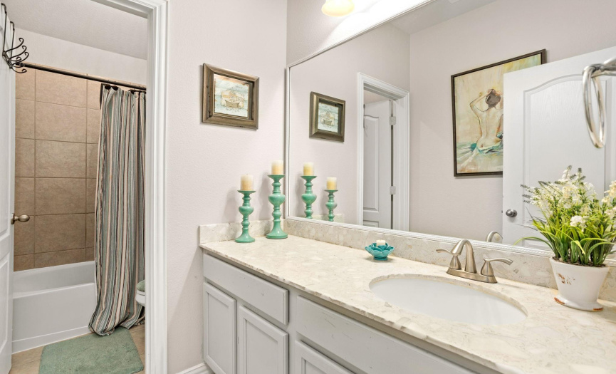 One of 2 full baths on the second level, this bathroom sits just off the game room area, allowing convenience for your guests.
