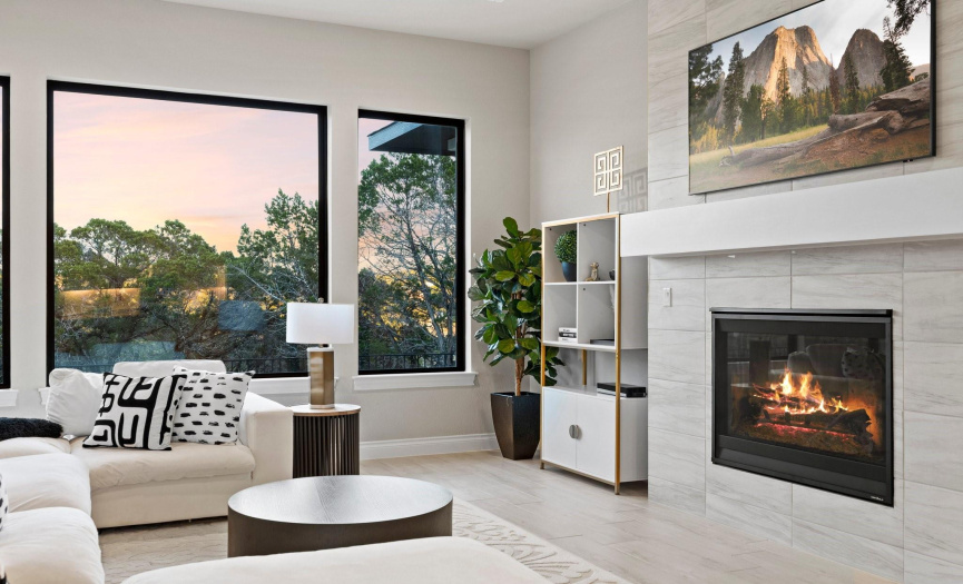 Complete with a mantle, this fireplace epitomizes sophistication and adds a touch of grandeur to the space.