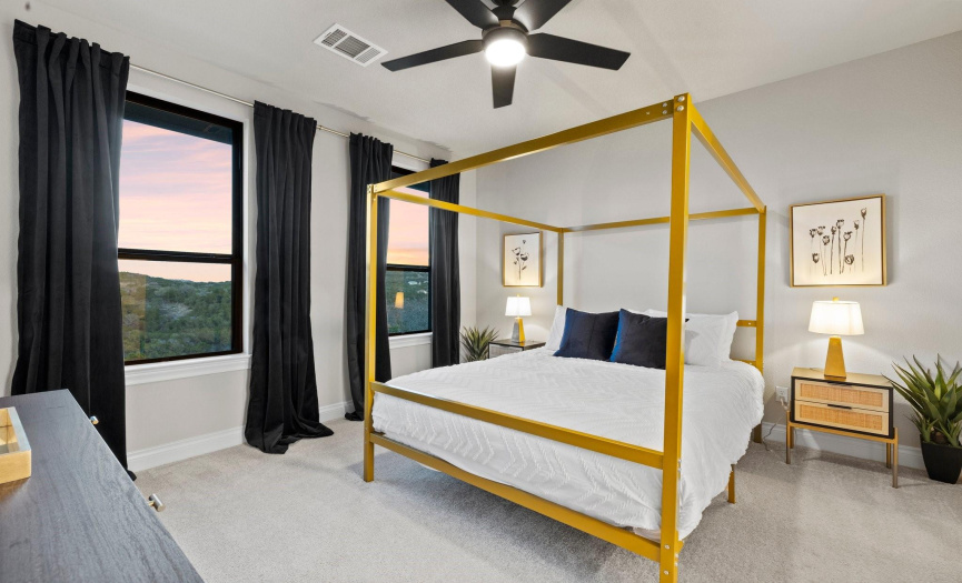 Welcome to the second of three spacious upstairs bedrooms, offering abundant natural light streaming in through large windows. Enjoy picturesque views of rolling hills from this inviting space.
