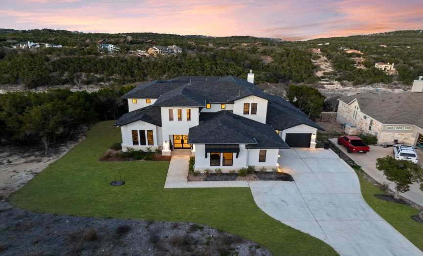An aerial view of the home, offering another perspective of the vast lot and expansive surroundings.