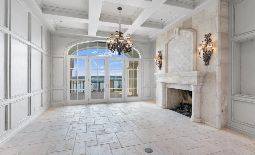 Formal Living room with Lake Travis views, coffered ceiling,  and gas fireplace