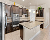 Kitchen with large granite island and room for barstools