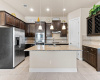 Recessed lighting as well as pendant lighting in kitchen