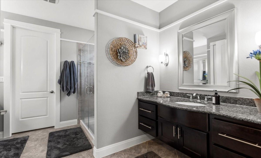  This Master bath offers dual vanities & an oversized shower
