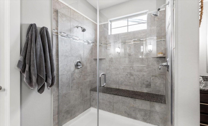 oversized master shower with a bench seat