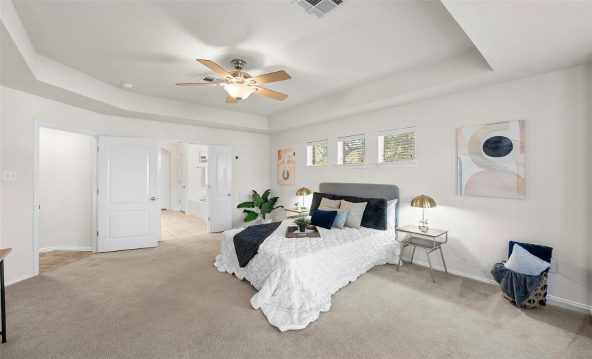 Tray ceiling adds height and space to the master bedroom. 