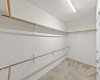 The spacious walk-in closet offers ample storage and organization solutions.