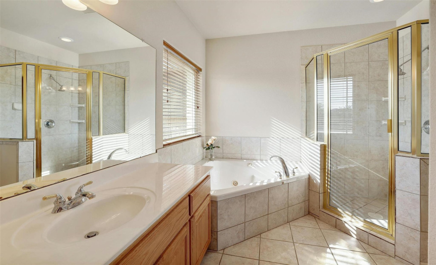 Owner's Spa with garden tub and walk-in shower.