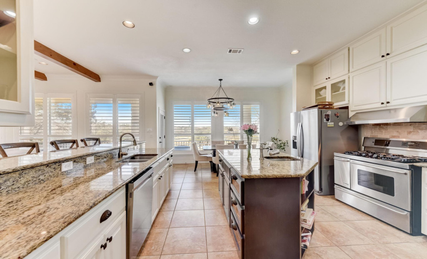 Chef's kitchen with granite counters and large island