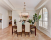 Notice the arched window and trey ceiling that accentuate this lovely dining room