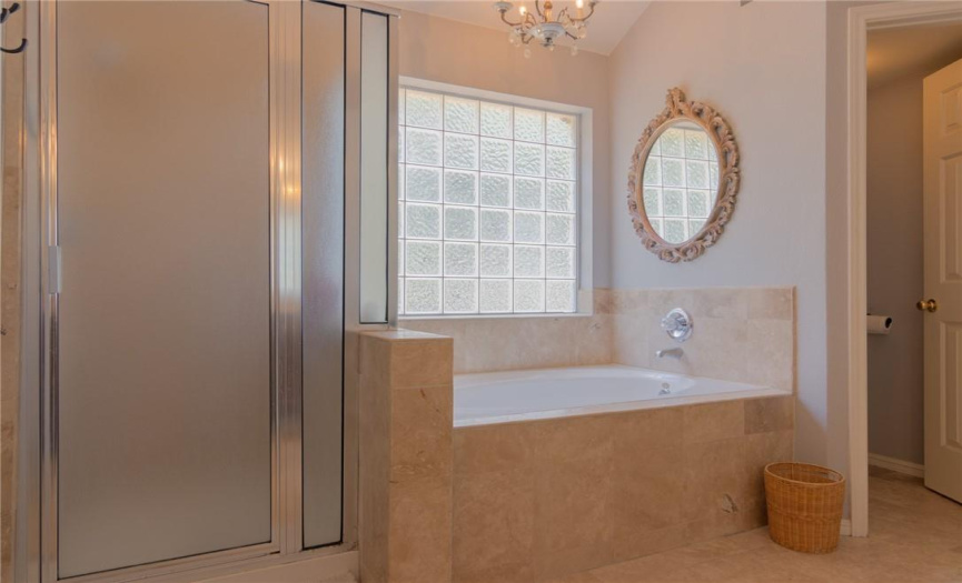 Primary bathroom with shower and separate soaking tub