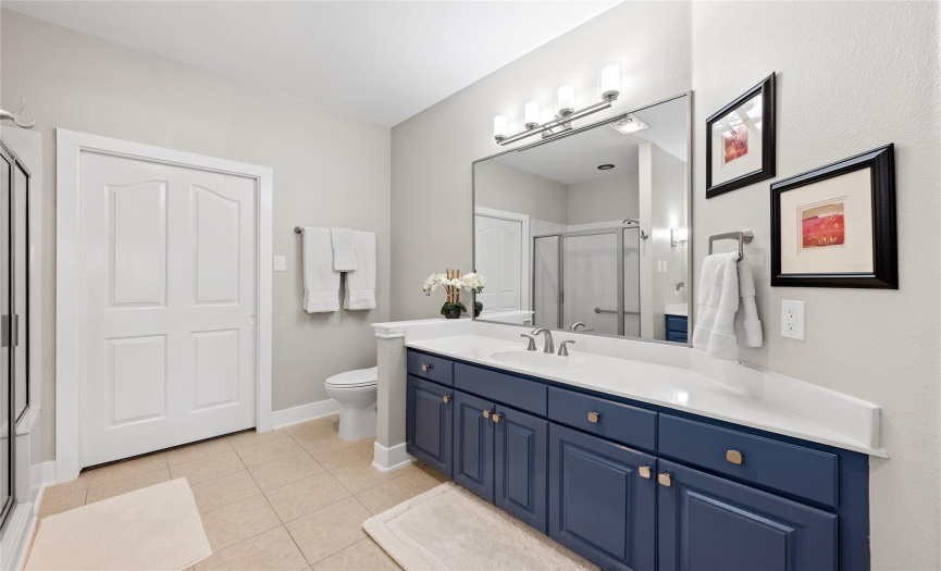 Master Bath with an oversize walk in shower with a bench seat.