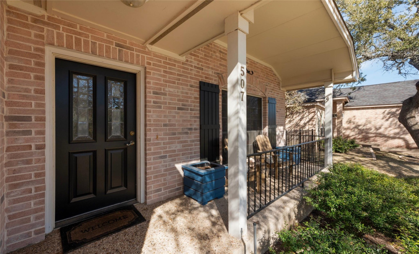 Such a peaceful front porch to sit & enjoy this serene neighborhood !