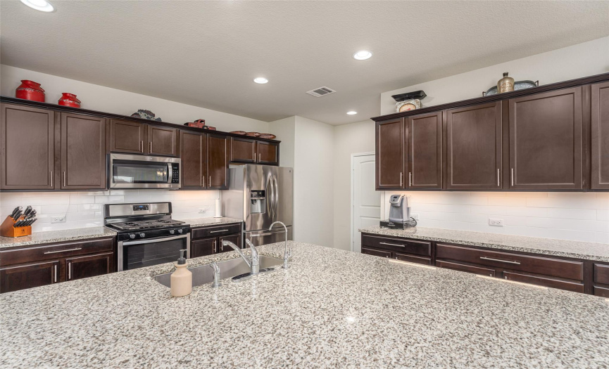 Exceptionally large kitchen with huge counter height island.