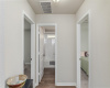 Small hallway to 2 beds and guest bath.