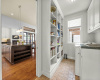 This is the BEST pantry space! A wall of built-ins makes it easy to see and access all of your supplies. The other half of this space is a laundry room and can be closed off with TALL pocket doors. 