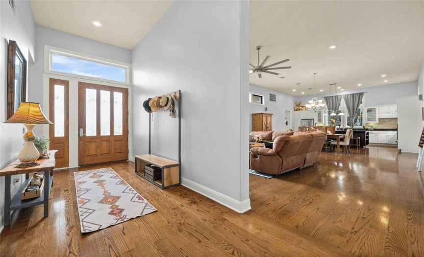 Bright and cheerful! Hardwood floors pave the way through this inviting home!