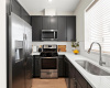 Stainless steel refrigerator located in the kitchen will convey.