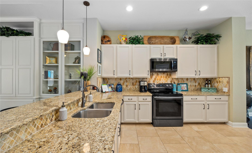 Gorgeous, updated appliances with diamond backsplash creates an enduring and stunning kitchen!