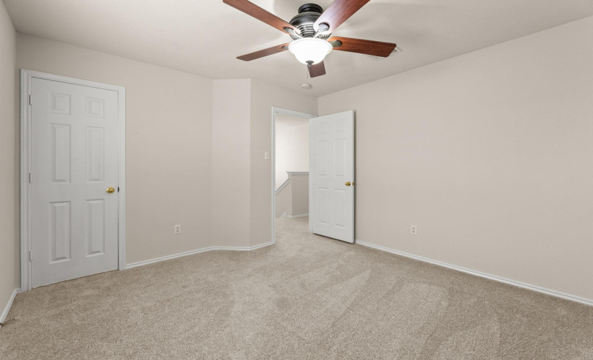 Another view of the fourth bedroom, located at the top of the stairs. You will find brand new carpet and fresh interior paint throughout the second floor.