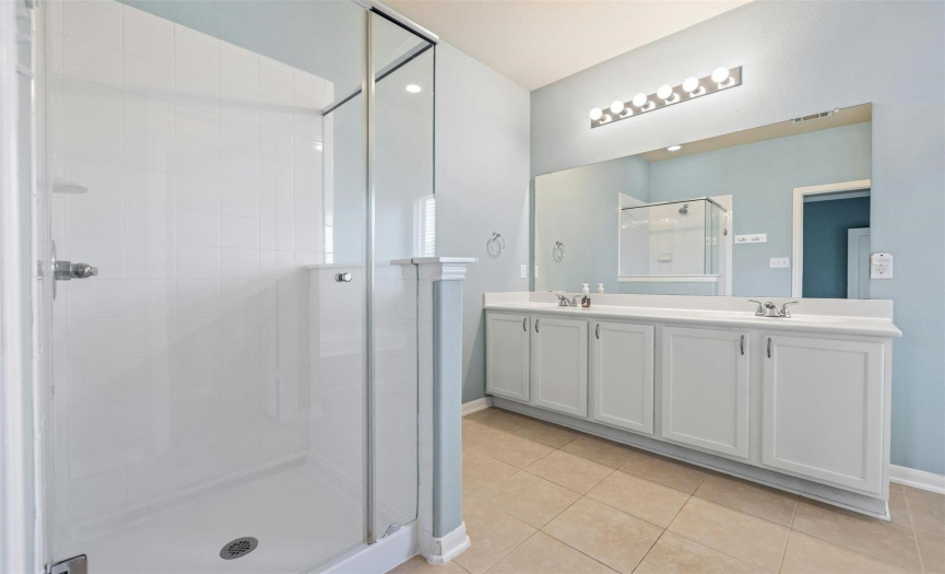 The primary ensuite bath with serve as your daily spa-getaway with a sizable walk-in shower, dual vanity, and separate garden tub. 