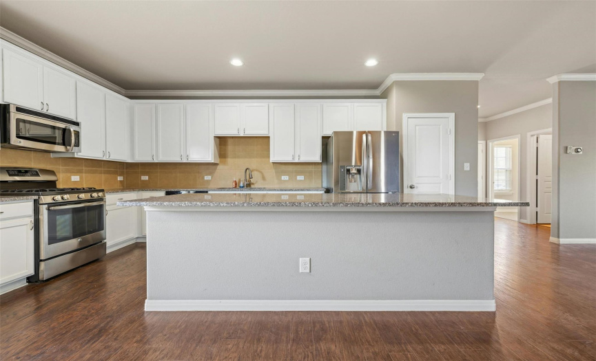 Several premium upgrades throughout including this gorgeous chef-inspired kitchen with an oversized center island. 