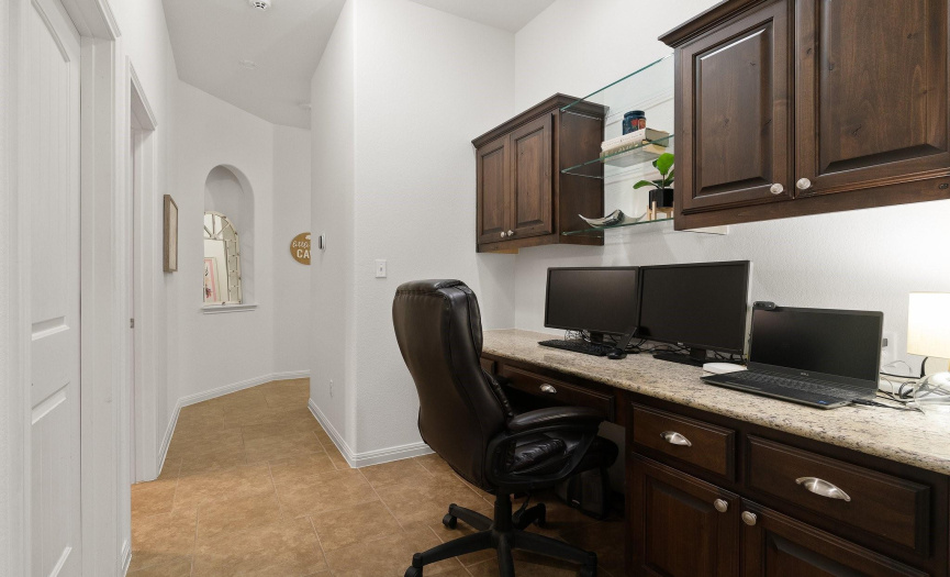 To the left of the entry foyer you will find the secondary bedroom hallway, which features this awesome built-in desk/study area.