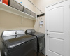 The in-home laundry room is located off the garage entry and opens into the secondary bedroom hallway. 