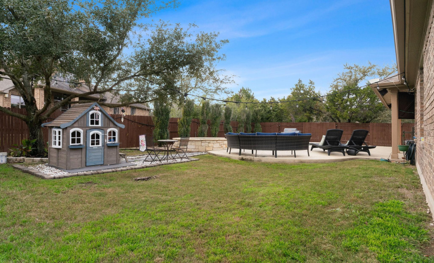 Also enjoy plenty of green lawn space for playing outside plus gorgeous landscaping with privacy hedges, a growing shade tree, and xeriscape patio extension. 