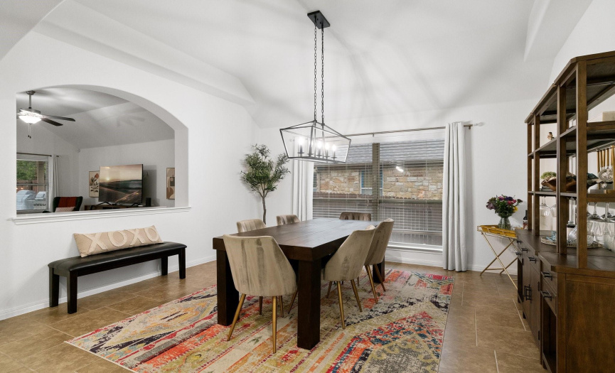 The elegant formal dining room connects to the main living area through an arching opening making entertaining a breeze.
