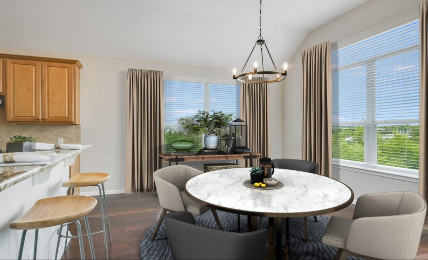Enjoy panoramic vistas while dining in this window-wrapped area *Virtually staged photo