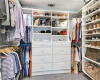 Marvel at the custom walk-in closet, meticulously designed to maximize organization and storage space, ensuring your wardrobe stays tidy and accessible at all times.