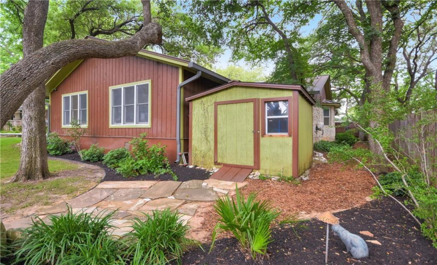 Unwind in the tranquil backyard oasis, complete with mature trees and a convenient storage shed, providing ample space for your gardening tools and outdoor equipment.