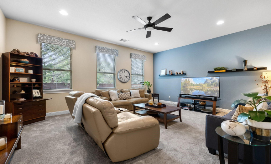 Entertain guests or enjoy family game nights in the spacious game room, complete with new upgraded carpet and floating shelves.