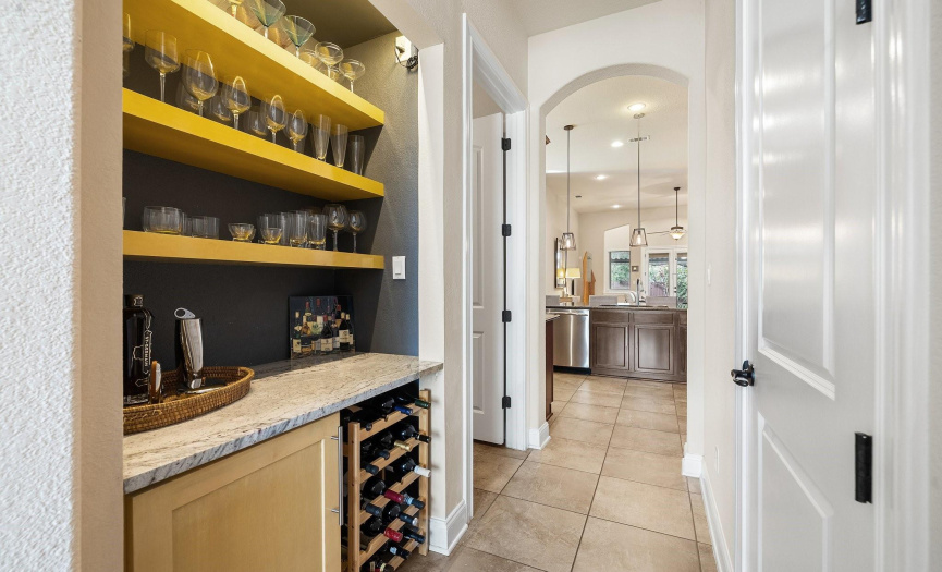 Explore the butler's pantry, complete with built-in wine storage, offering both functionality and elegance for effortless entertaining.