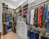 Master closet is custom designed for ultimate storage.