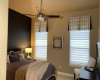 The guest bedroom also has Hunter Douglas silouette blinds.