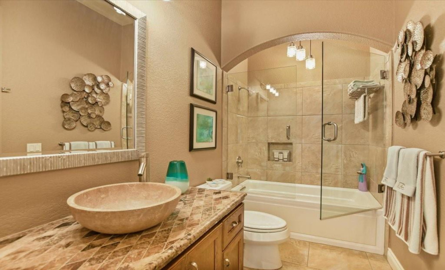 Come be our guest in this handsome guest bath complete with vessel sink. 