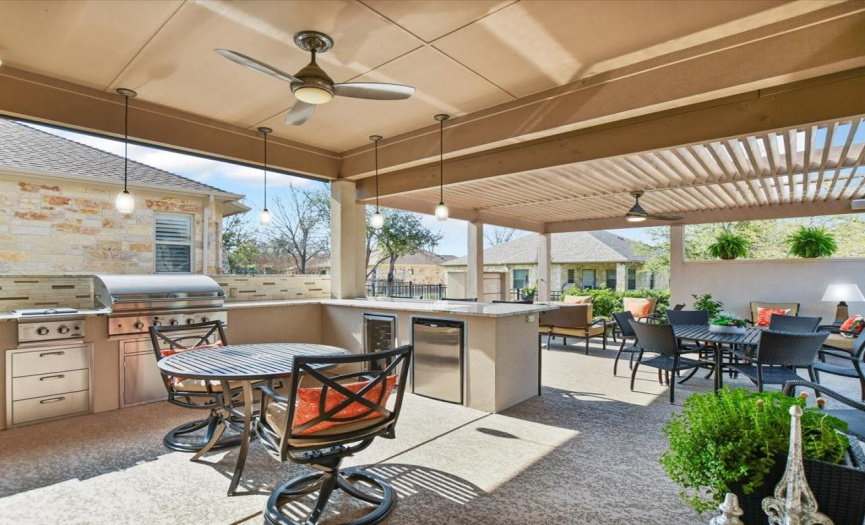 Why go inside when you have this delightful outdoor kitchen and oversized patio...