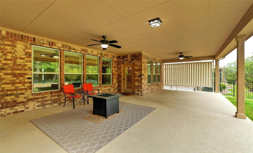 Relax or entertain under a lengthy covered back patio!