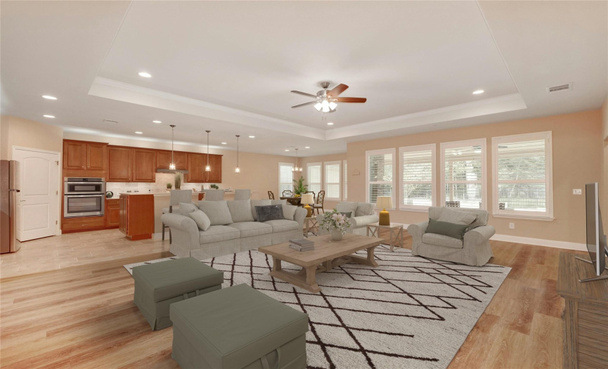 Virtually Staged: Open living space with luxury vinyl plank flooring underfoot.