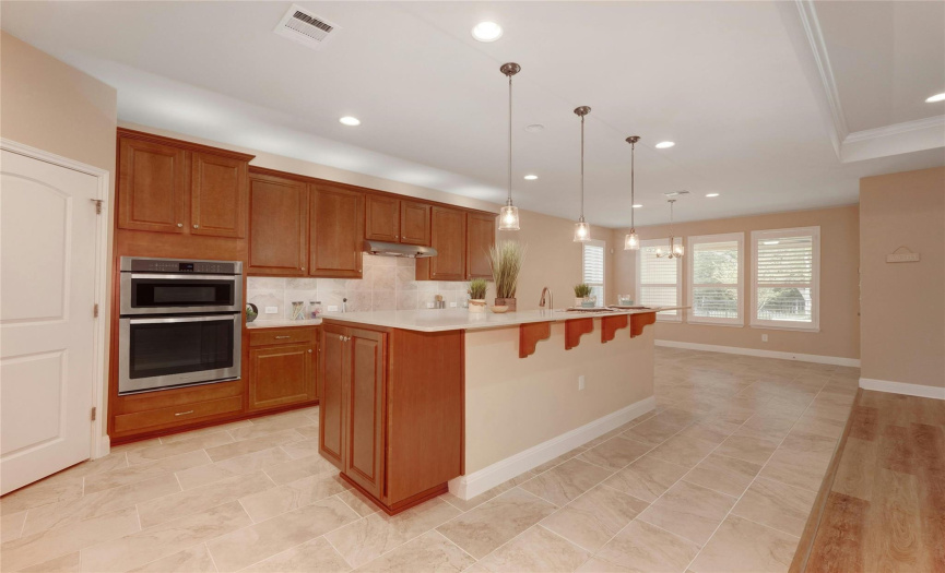 Kitchen includes built-in Whirlpool microwave and oven, plus a walk-in corner pantry!