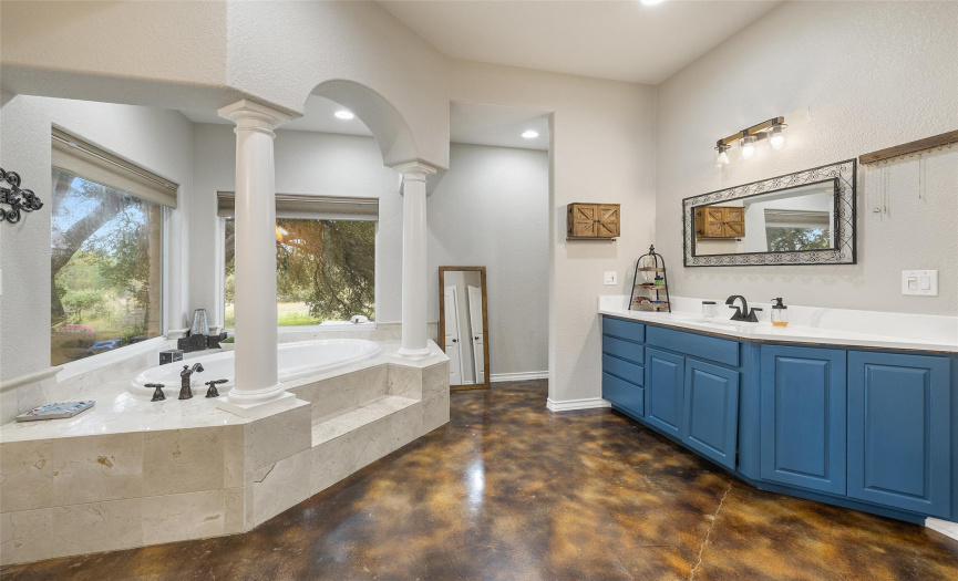 Imagine setting up your ideal home spa sanctuary around the idyllic soaking tub in this amazing ensuite bathroom! Also enjoy a tucked away private commode. 